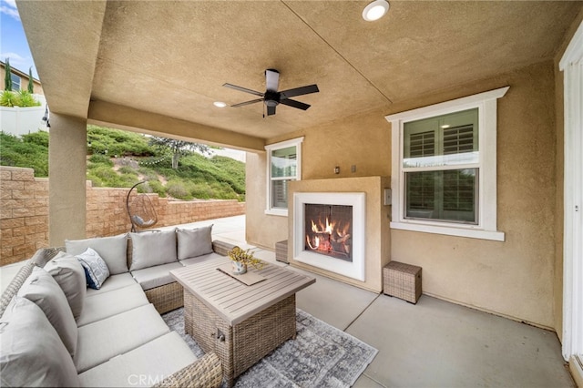 33378 Barmetta Ln, Temecula, CA 92592 - view of patio / terrace with an outdoor living space with a fireplace, fence, and a ceiling fan