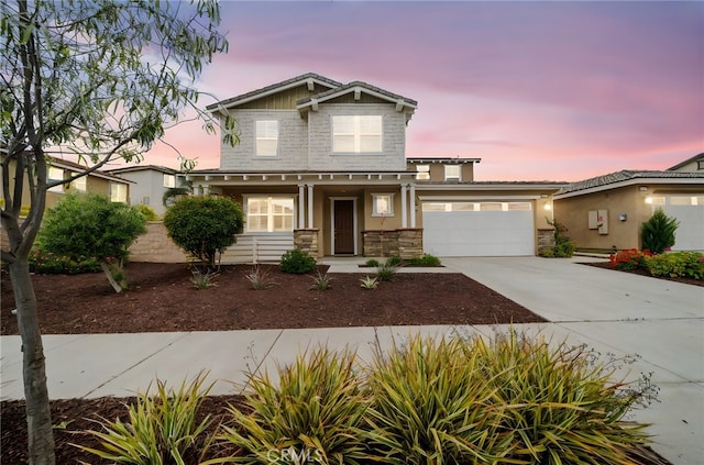 33378 Barmetta Ln, Temecula, CA 92592 - craftsman inspired home featuring stone siding, a porch, driveway, a garage, and stucco siding