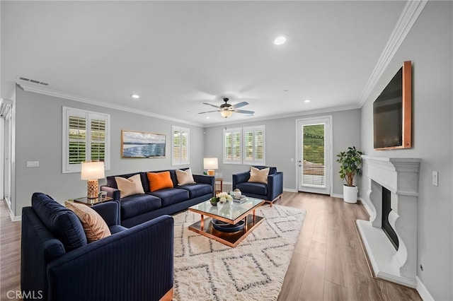 33378 Barmetta Ln, Temecula, CA 92592 - living area with recessed lighting, plenty of natural light, crown molding, a ceiling fan, and wood finished floors