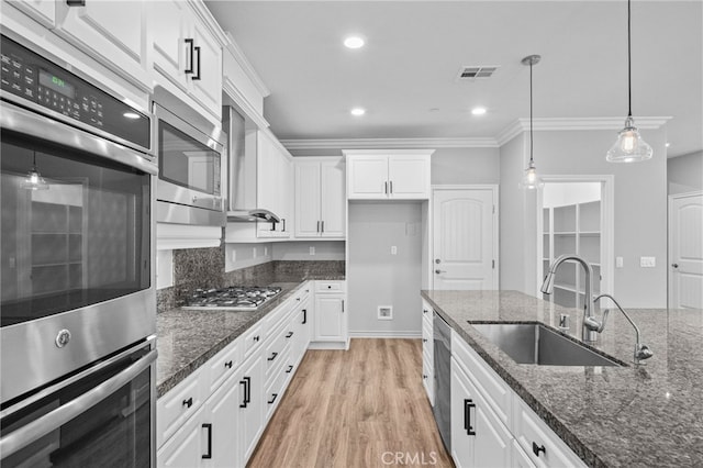 33378 Barmetta Ln, Temecula, CA 92592 - kitchen with a sink, stainless steel appliances, white cabinetry, pendant lighting, and recessed lighting