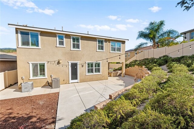 33378 Barmetta Ln, Temecula, CA 92592 - rear view of house with a patio, a fenced backyard, stucco siding, and cooling unit