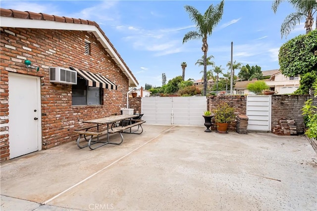1475 Trenton Dr, Riverside, CA 92506 - view of patio / terrace with a wall unit AC and outdoor dining area