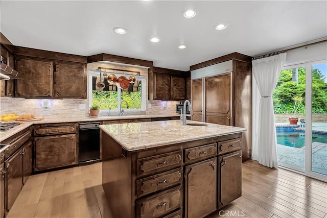 1475 Trenton Dr, Riverside, CA 92506 - kitchen featuring a sink, light wood-style floors, decorative backsplash, and recessed lighting