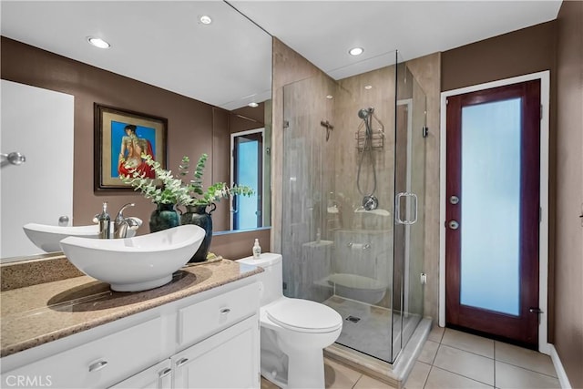1475 Trenton Dr, Riverside, CA 92506 - bathroom featuring a stall shower, tile patterned floors, vanity, toilet, and recessed lighting