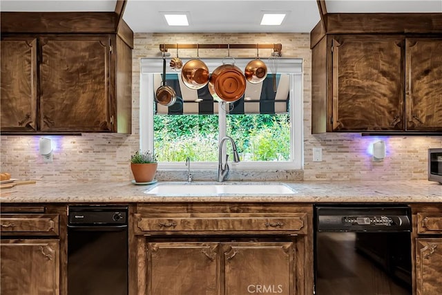 1475 Trenton Dr, Riverside, CA 92506 - kitchen with black dishwasher, a sink, decorative backsplash, and dark brown cabinetry