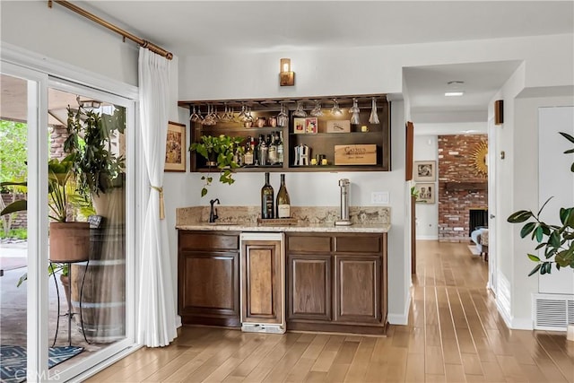 1475 Trenton Dr, Riverside, CA 92506 - indoor wet bar featuring light wood-type flooring and baseboards