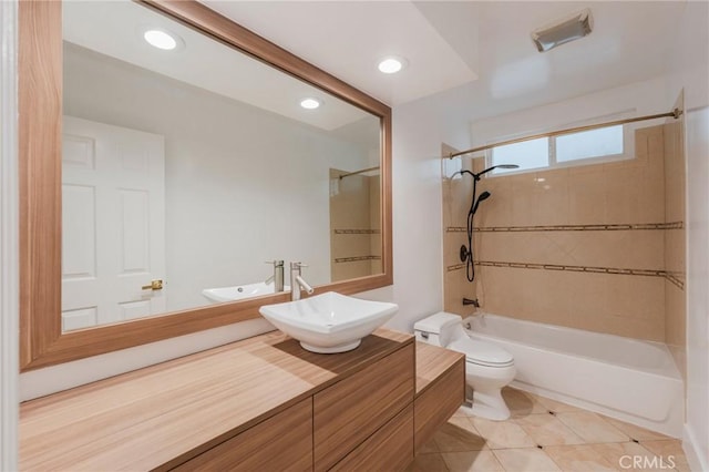 full bath featuring shower / tub combination, toilet, tile patterned flooring, vanity, and recessed lighting