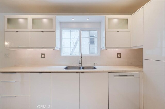 8963 Burton Way Unit 103, Los Angeles, CA 90048 - kitchen featuring dishwasher, a sink, white cabinets, and light countertops