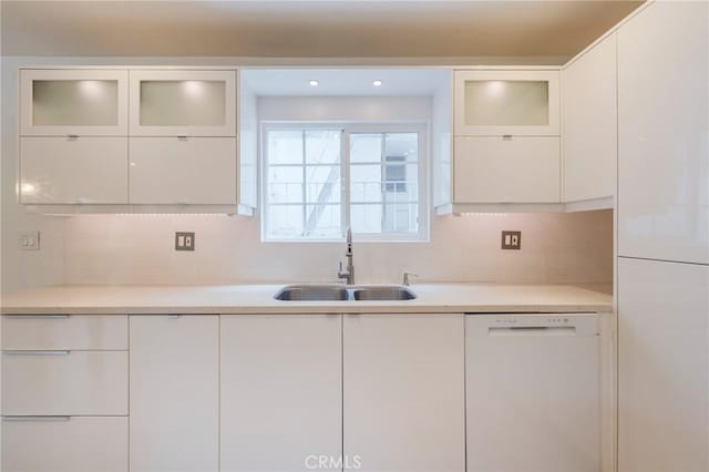 8963 Burton Way Unit 103, Los Angeles, CA 90048 - kitchen with white dishwasher, a sink, white cabinets, and light countertops