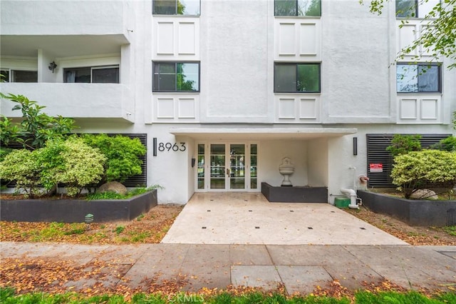 8963 Burton Way Unit 103, Los Angeles, CA 90048 - doorway to property featuring stucco siding