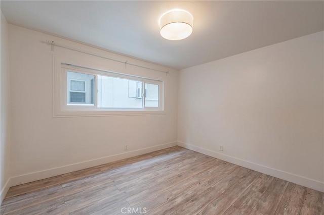 8963 Burton Way Unit 103, Los Angeles, CA 90048 - spare room featuring light wood-style floors and baseboards