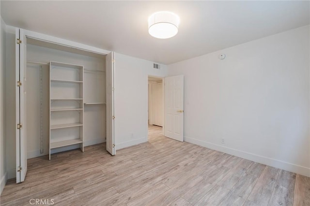 8963 Burton Way Unit 103, Los Angeles, CA 90048 - unfurnished bedroom featuring light wood finished floors and baseboards