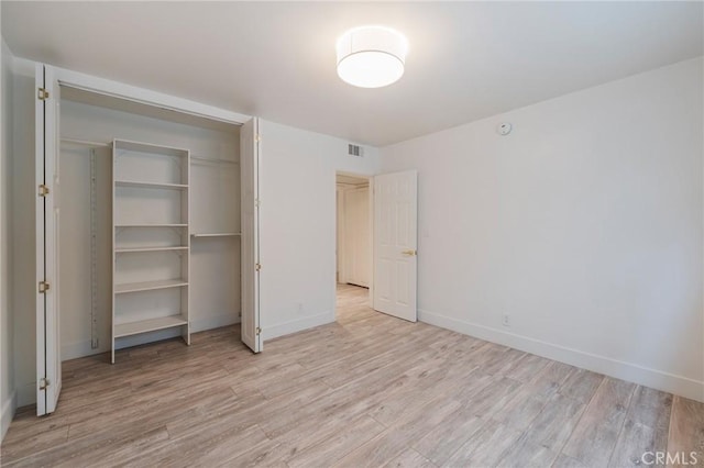 8963 Burton Way Unit 103, Los Angeles, CA 90048 - unfurnished bedroom featuring light wood-style flooring and baseboards