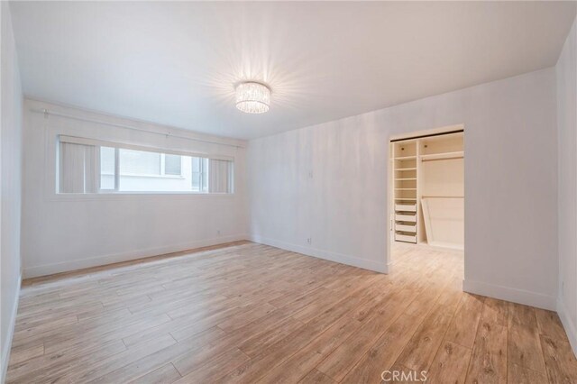 8963 Burton Way Unit 103, Los Angeles, CA 90048 - empty room with light wood-type flooring and baseboards