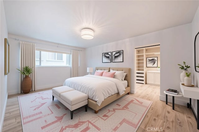 8963 Burton Way Unit 103, Los Angeles, CA 90048 - bedroom featuring light wood-type flooring and baseboards