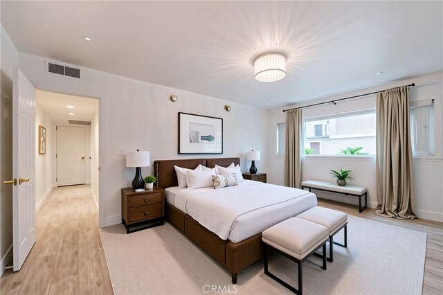 8963 Burton Way Unit 103, Los Angeles, CA 90048 - bedroom featuring light wood-type flooring and baseboards