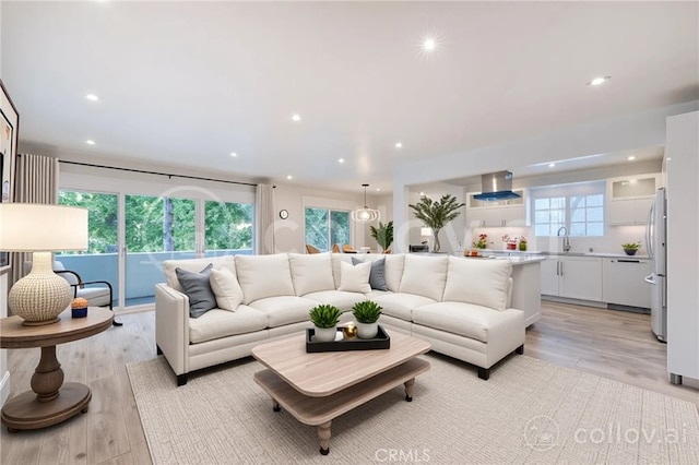 8963 Burton Way Unit 103, Los Angeles, CA 90048 - living area with light wood-type flooring and recessed lighting