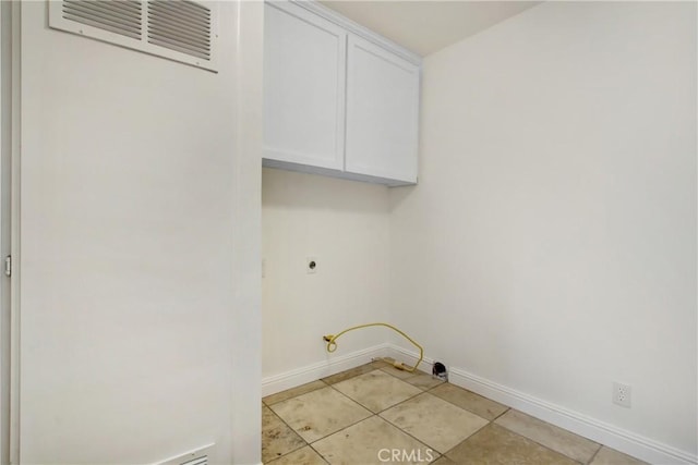 43195 Andrade Ave Unit A, Hemet, CA 92544 - clothes washing area with cabinet space, baseboards, light tile patterned floors, and gas dryer hookup
