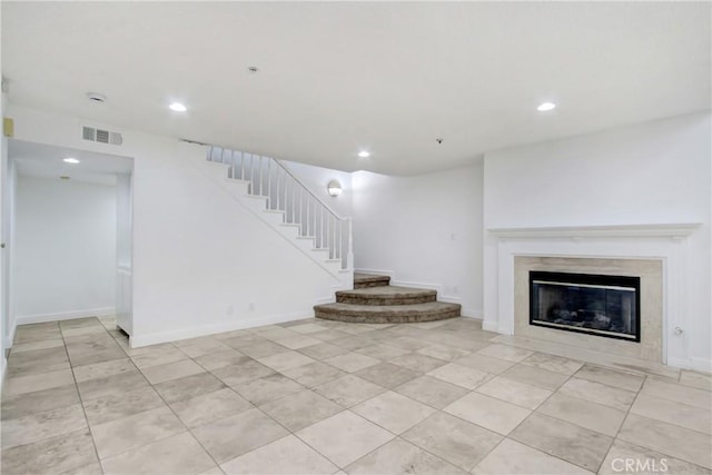 43195 Andrade Ave Unit A, Hemet, CA 92544 - unfurnished living room with stairway, recessed lighting, a fireplace, baseboards, and light tile patterned floors