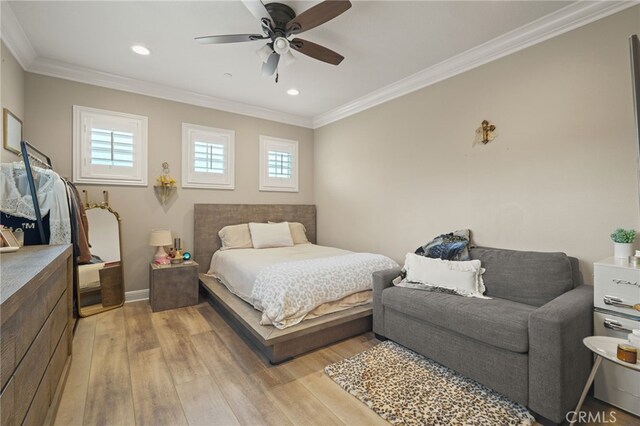 bedroom featuring light wood-style flooring, ornamental molding, recessed lighting, a ceiling fan, and baseboards