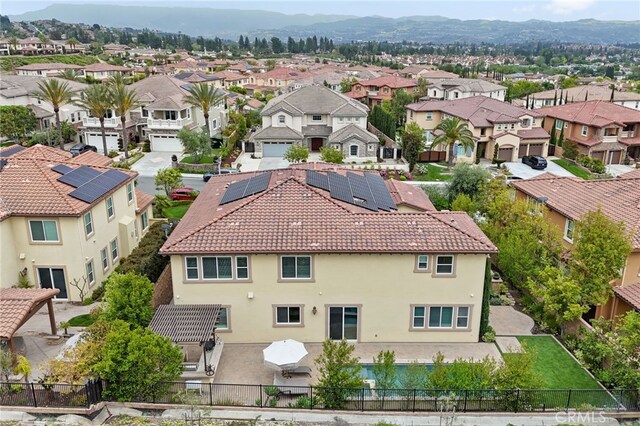 aerial perspective of suburban area featuring a mountainous background
