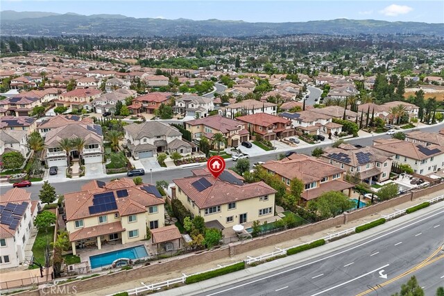 aerial perspective of suburban area with a mountainous background