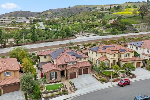 aerial view of residential area featuring a mountainous background