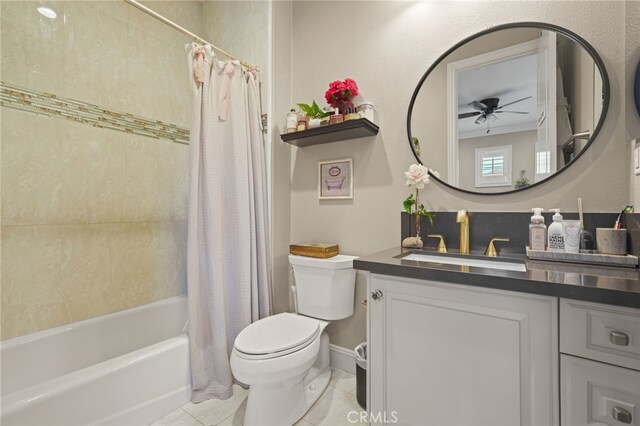 full bath with a ceiling fan, toilet, tile patterned flooring, vanity, and shower / bath combo