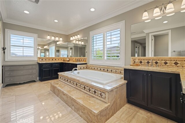 bathroom featuring a bath, crown molding, recessed lighting, two vanities, and marble finish floors