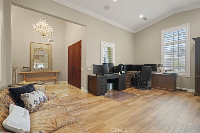 office with crown molding, light wood-type flooring, plenty of natural light, vaulted ceiling, and a chandelier