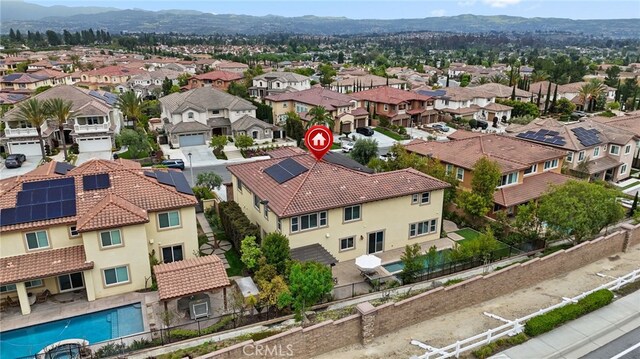 aerial view of residential area with a mountainous background
