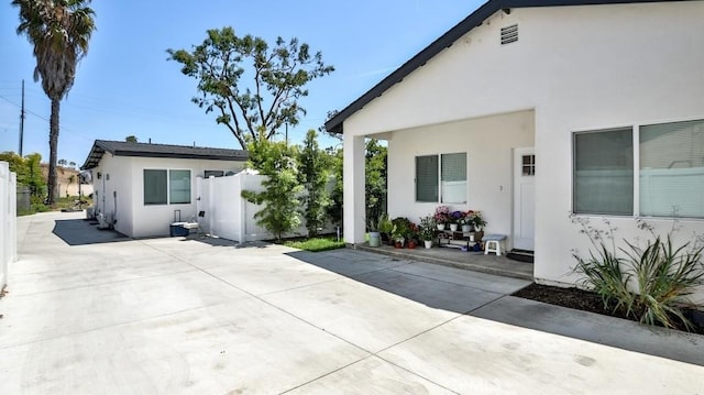 13611 Glenhaven Dr, Garden Grove, CA 92843 - rear view of house with stucco siding, a patio, and fence