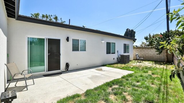13611 Glenhaven Dr, Garden Grove, CA 92843 - back of property featuring stucco siding, cooling unit, and a patio area