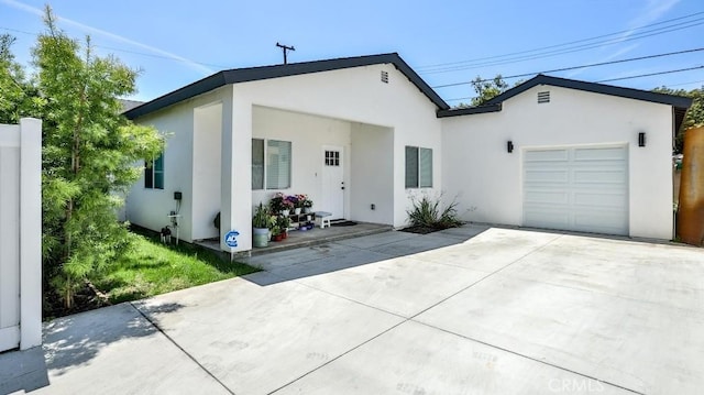 13611 Glenhaven Dr, Garden Grove, CA 92843 - view of front of house featuring an attached garage, stucco siding, and driveway