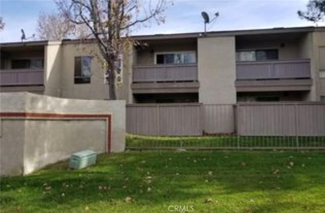 view of yard with a balcony