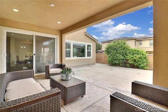 view of patio featuring fence