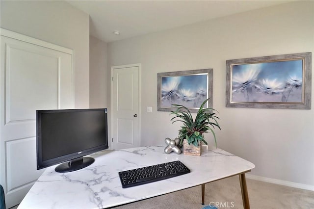 office with light colored carpet and baseboards