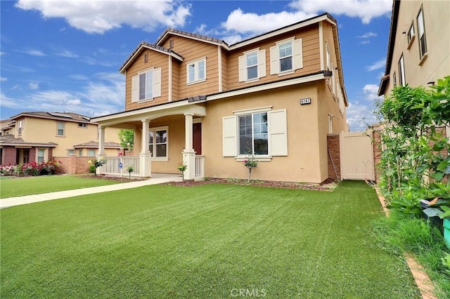 view of front of home with covered porch and stucco siding