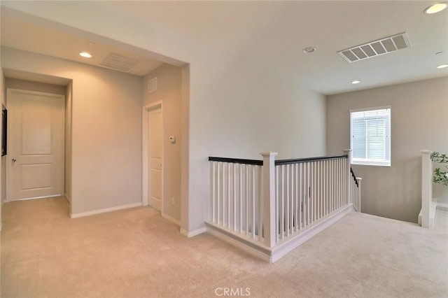 hall featuring an upstairs landing, carpet, recessed lighting, and baseboards