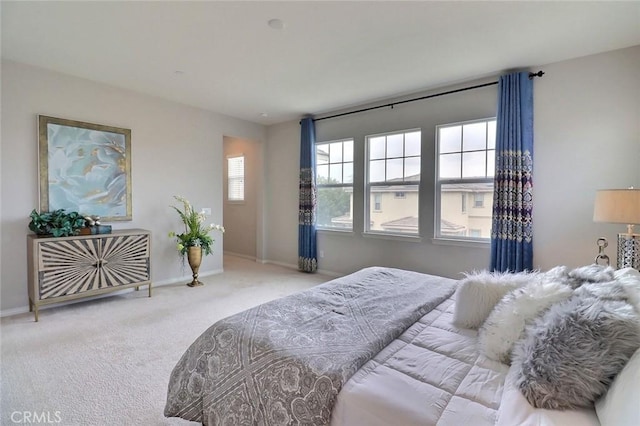 carpeted bedroom with baseboards