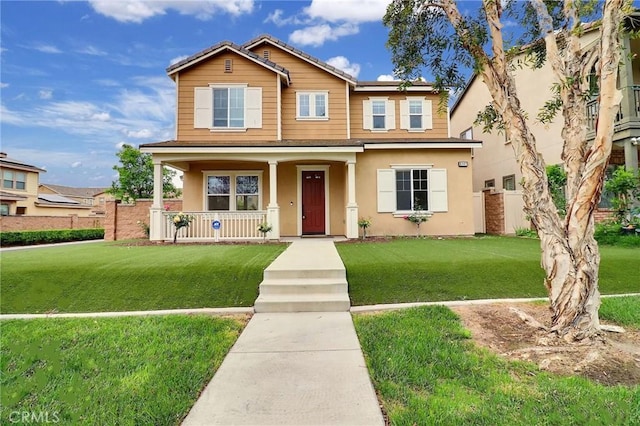 view of front of home with a porch and stucco siding