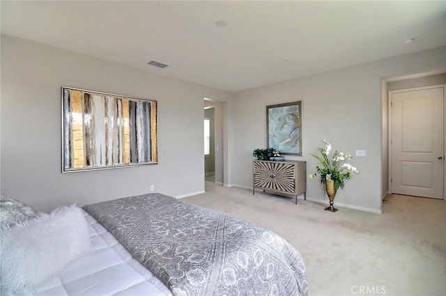 bedroom with carpet flooring and baseboards