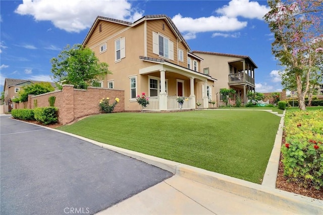 view of front of house featuring stucco siding and a porch