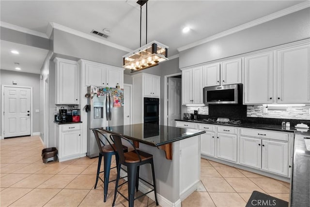 11874 Grayhawk Cir, Yucaipa, CA 92399 - kitchen with stainless steel appliances, light tile patterned floors, white cabinetry, decorative backsplash, and crown molding