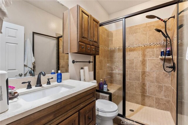 11874 Grayhawk Cir, Yucaipa, CA 92399 - bathroom with a stall shower, toilet, and vanity