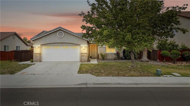 809 Early Dawn Way, San Jacinto, CA 92582 - view of front facade featuring stucco siding, a garage, concrete driveway, and brick siding