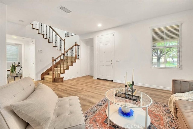 37089 Meadow Brook Way, Beaumont, CA 92223 - living area featuring baseboards, light wood-style flooring, stairs, and recessed lighting
