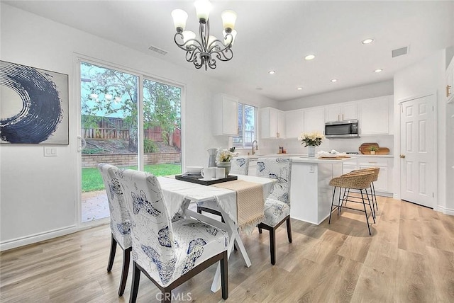 37089 Meadow Brook Way, Beaumont, CA 92223 - dining area featuring a chandelier, light wood finished floors, and recessed lighting