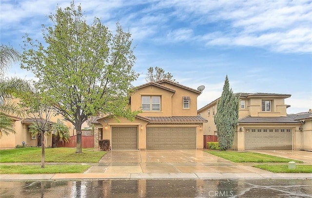 37089 Meadow Brook Way, Beaumont, CA 92223 - view of front of home featuring an attached garage, a tile roof, stucco siding, and driveway