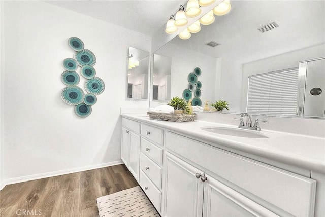 37089 Meadow Brook Way, Beaumont, CA 92223 - full bathroom with wood finished floors, double vanity, and baseboards
